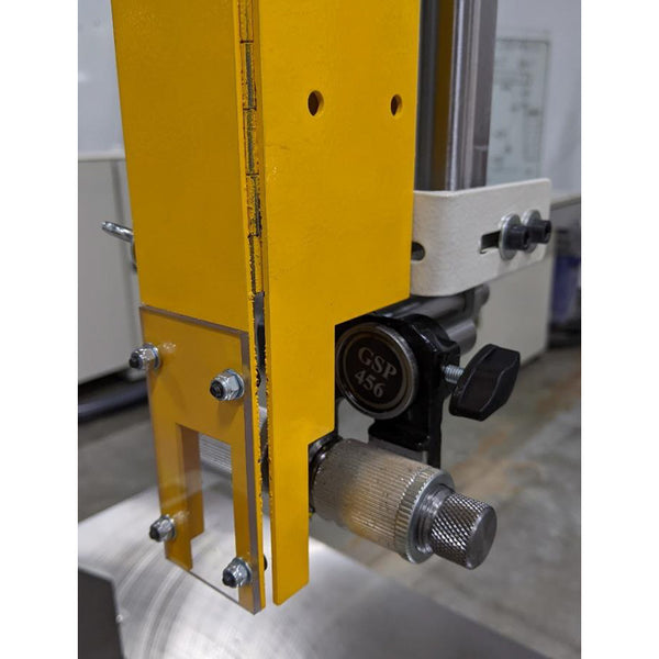Upper blade guide assembly on the SCM Formula S 540P mounted to the yellow guide post with knurled adjustment knob and locking lever